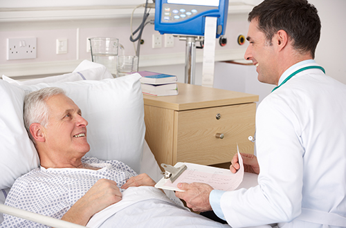 urologist reviewing post-operative instructions with patient in hospital
