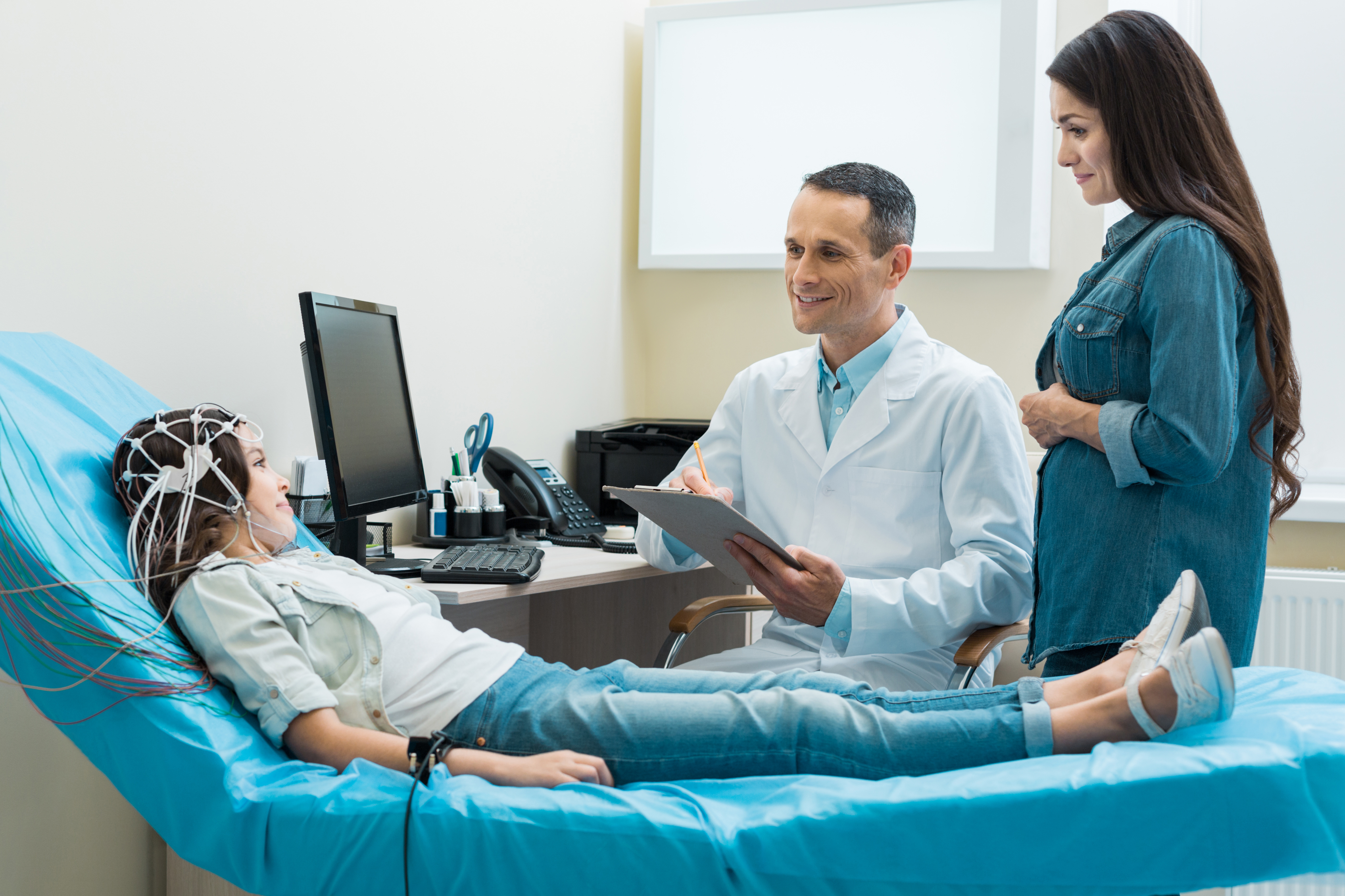 neurologist examining girl