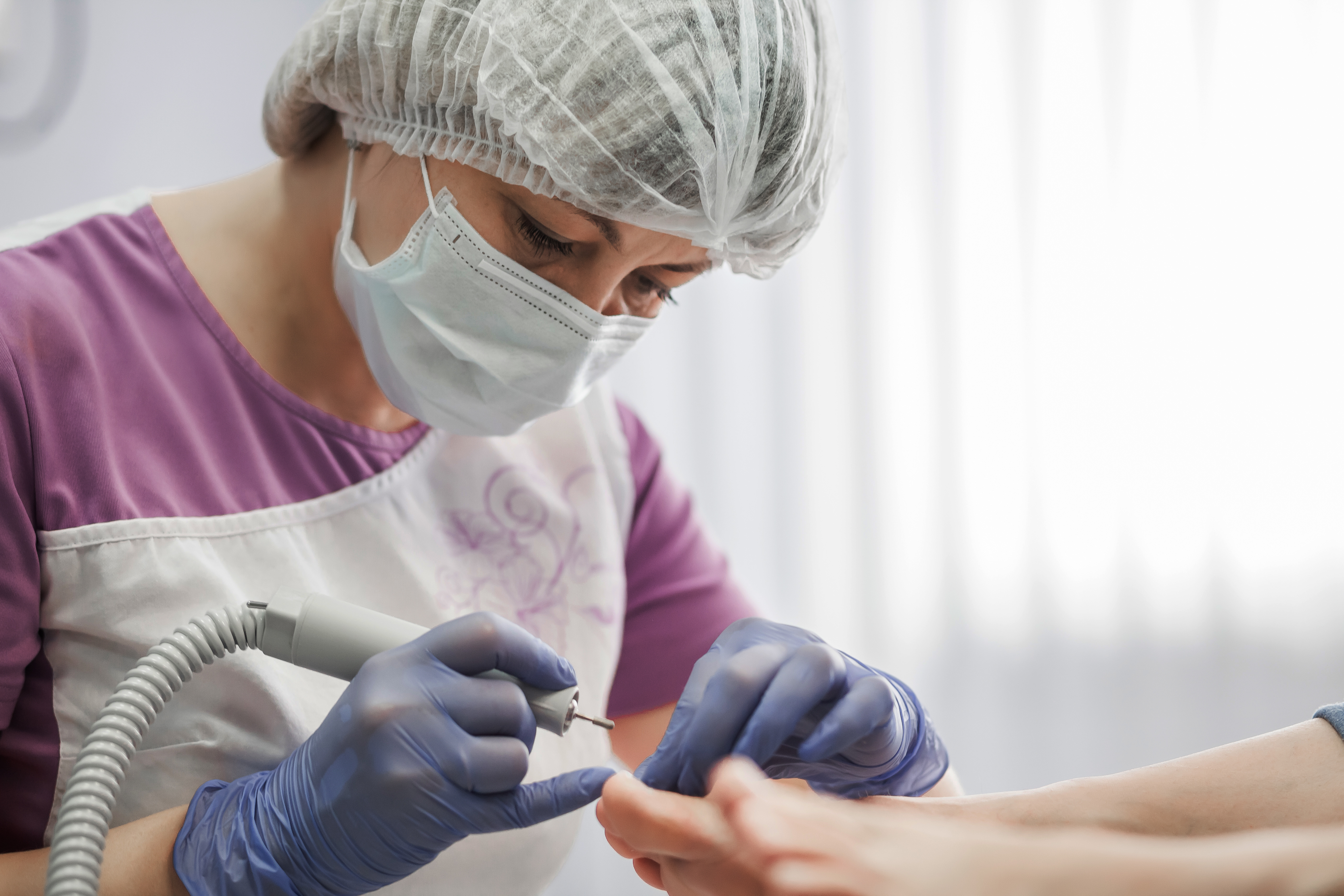 podiatrist examining foot