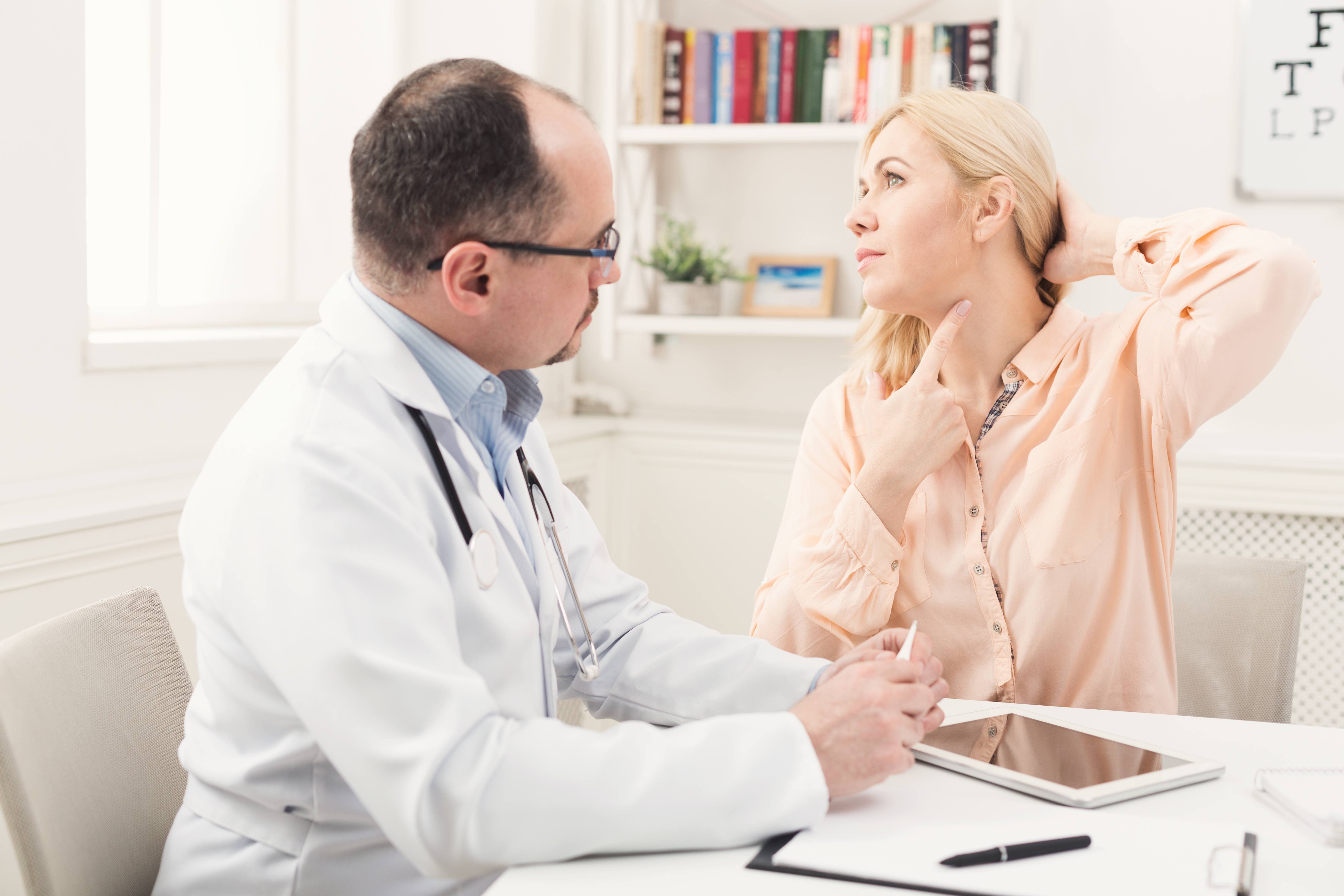 plastic surgeon helping woman 