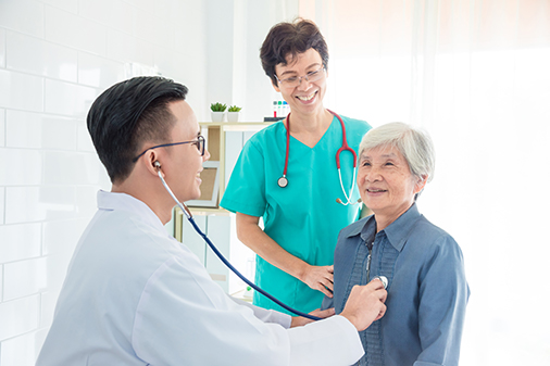 physician with patient and family