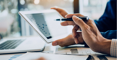 reviewing finanical reports on an iPad