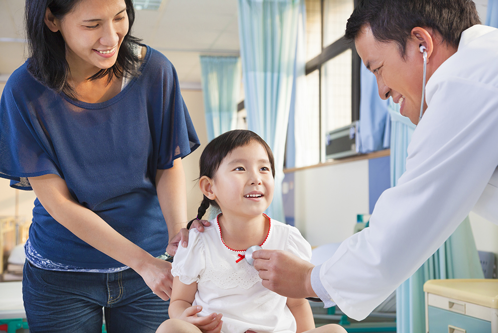 physician with patients and family